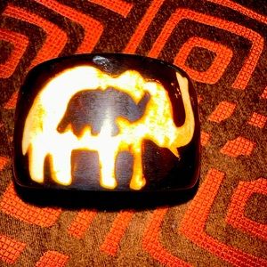 Wooden Cuff Bracelet adorned with elephants on all sides.